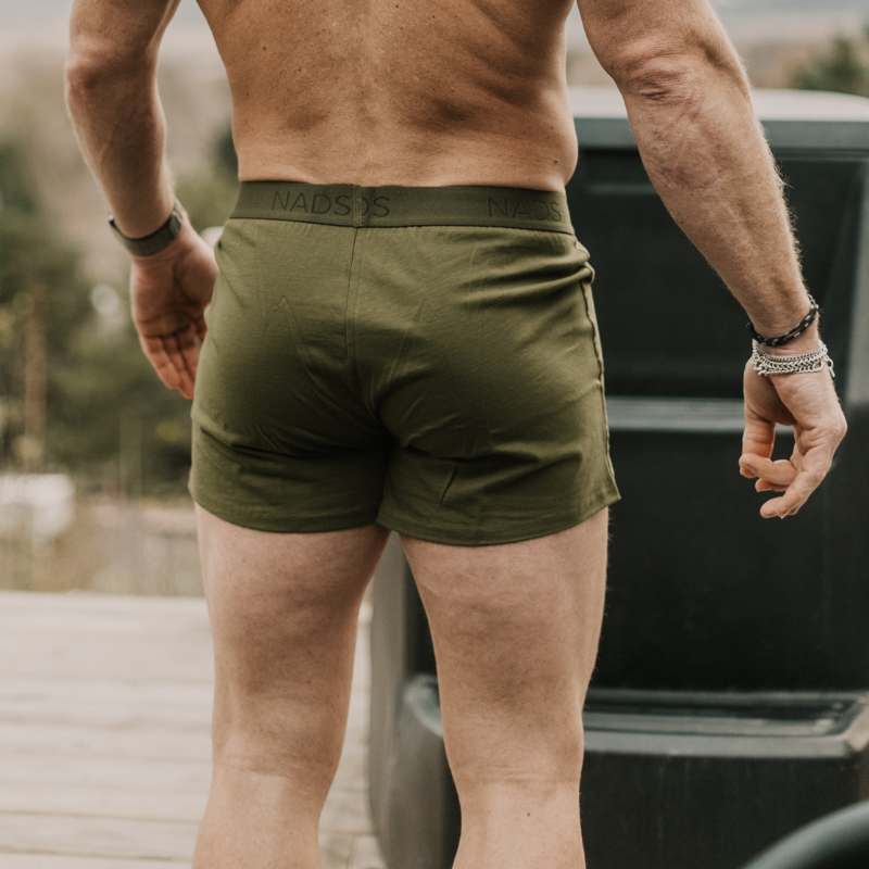 Man standing, facing away from the camera in a NADS Green Organic Cotton Boxer. 
