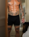 Up close image of a man wearing a black NADS boxer brief