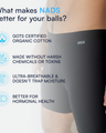 Man wearing black NADS boxer briefs with overlay text highlighting benefits: organic cotton, no harsh chemicals, ultra-breathable, and better for hormonal health.