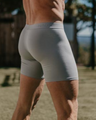 Man standing, facing away from the camera in a NADS Gray Organic Cotton Boxer Brief. 